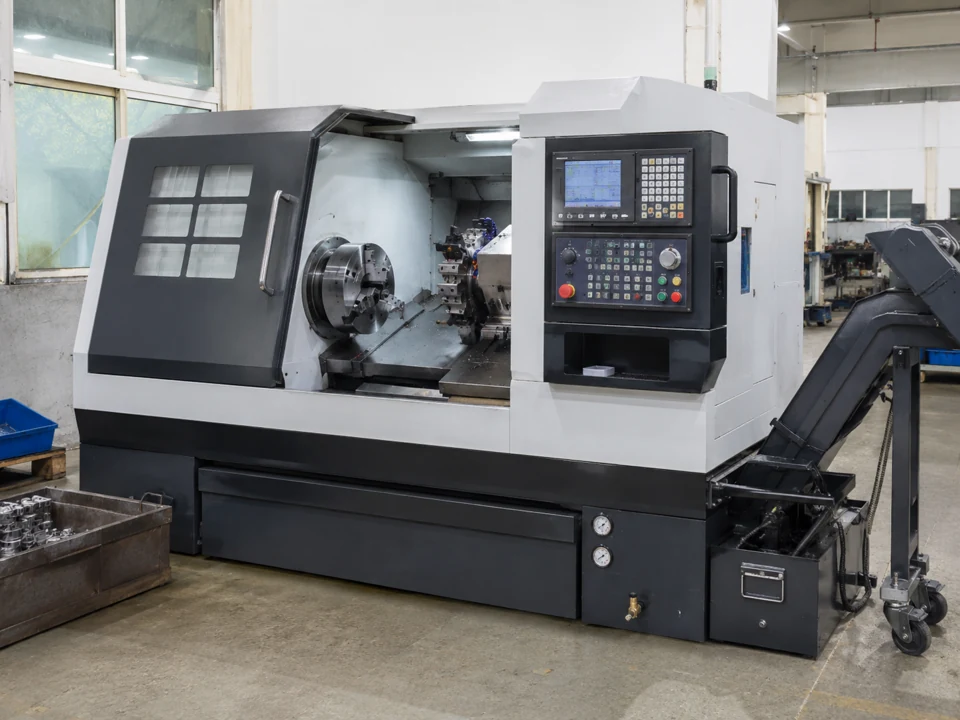 CNC lathe with an open work area and chip conveyor