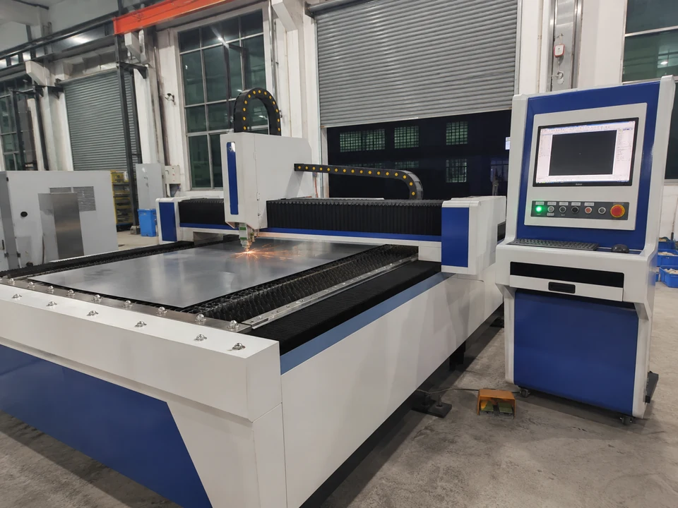 Gantry sheet cutting table beside its freestanding control panel